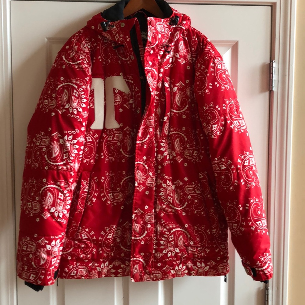 Red and white snowboarder jacket